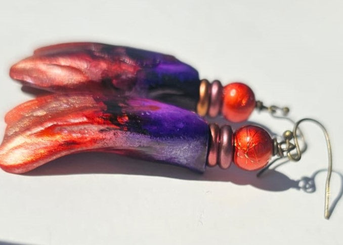 "Roc-N-Lobes Earrings" (Red/Purple Handpainted Buffalo Teeth) by Michele L. Scott